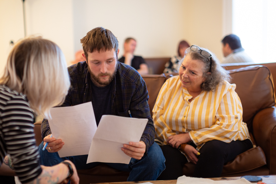 example of a resident at The Bridges Hull holding paperwork example of a resident at The Bridges Hull holding paperwork